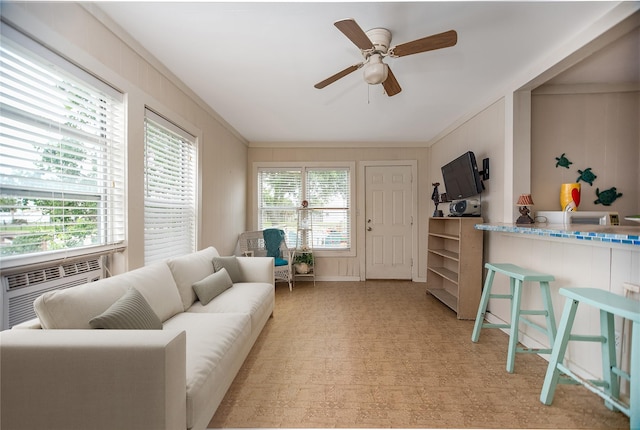 120 W Main St, Port O Connor, TX 77982 - living room featuring crown molding, ceiling fan, and light flooring