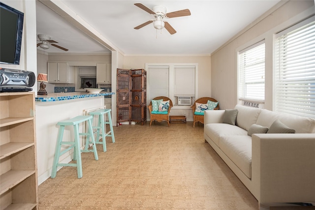 120 W Main St, Port O Connor, TX 77982 - living room featuring ceiling fan, light floors, crown molding, and cooling unit