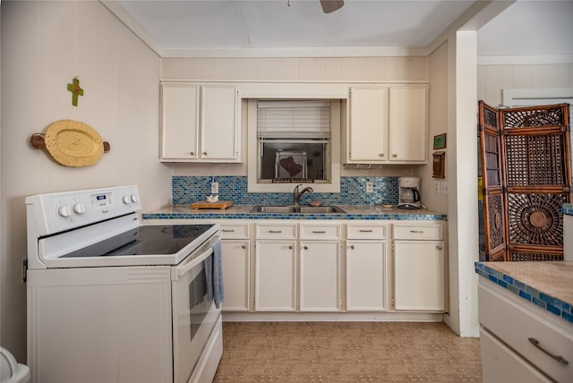 120 W Main St, Port O Connor, TX 77982 - kitchen with white range with electric stovetop, decorative backsplash, and light flooring