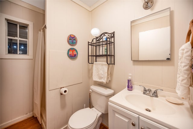 120 W Main St, Port O Connor, TX 77982 - full bathroom featuring vanity, wood finished floors, a decorative wall, and curtained shower