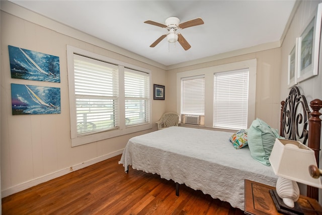 120 W Main St, Port O Connor, TX 77982 - bedroom with wood finished floors, cooling unit, and a ceiling fan