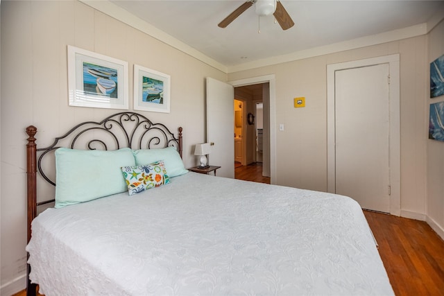 120 W Main St, Port O Connor, TX 77982 - bedroom featuring wood finished floors, ceiling fan, and ornamental molding