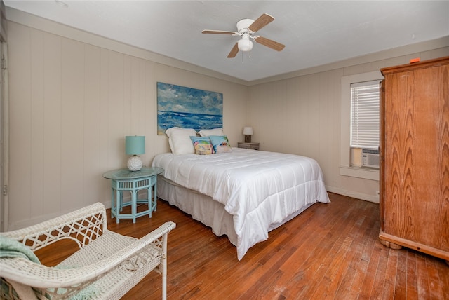 120 W Main St, Port O Connor, TX 77982 - bedroom featuring hardwood / wood-style flooring, cooling unit, and a ceiling fan