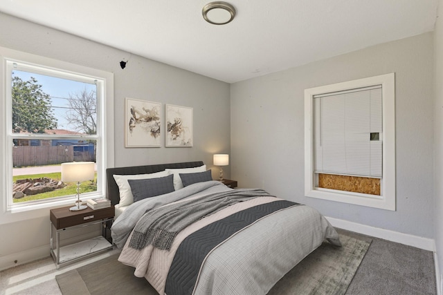 carpeted bedroom with baseboards