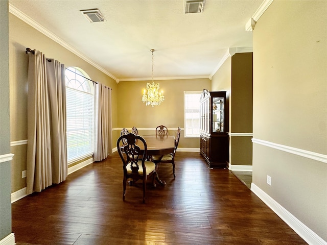 dining area featuring visible vents, a chandelier, and dark wood finished floors