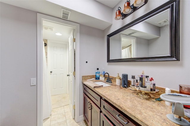 bathroom featuring vanity, tile patterned flooring, and visible vents
