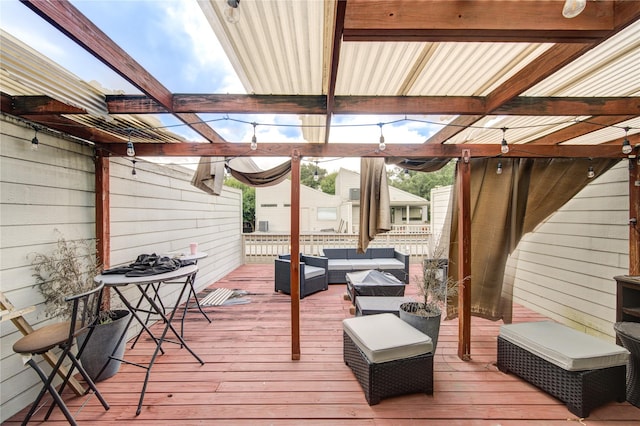 wooden terrace featuring outdoor lounge area