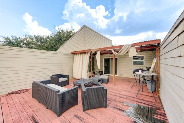 wooden deck with an outdoor living space