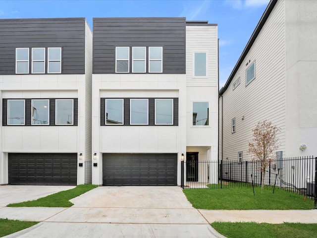 2320 Mcilhenny St, Houston, TX 77004 - view of front of home with driveway, a garage, fence, and stucco siding