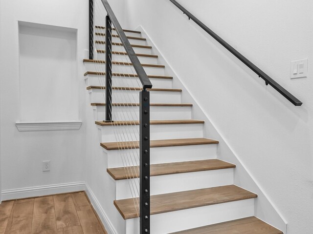 2320 Mcilhenny St, Houston, TX 77004 - staircase with wood finished floors and baseboards