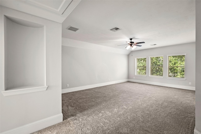 carpeted empty room with visible vents, baseboards, and a ceiling fan