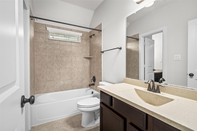 bathroom with tile patterned flooring, vanity, toilet, and shower / washtub combination
