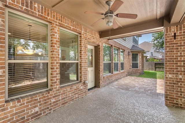 view of patio / terrace featuring fence and a ceiling fan