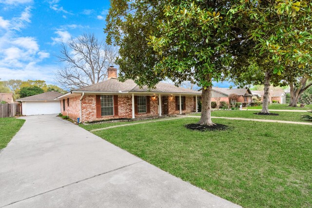 800 Fairway Dr, Richmond, TX 77469 - ranch-style house featuring concrete driveway, a chimney, a front lawn, brick siding, and fence