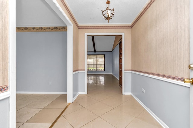 800 Fairway Dr, Richmond, TX 77469 - corridor with light tile patterned floors, baseboards, ornamental molding, a chandelier, and a textured ceiling