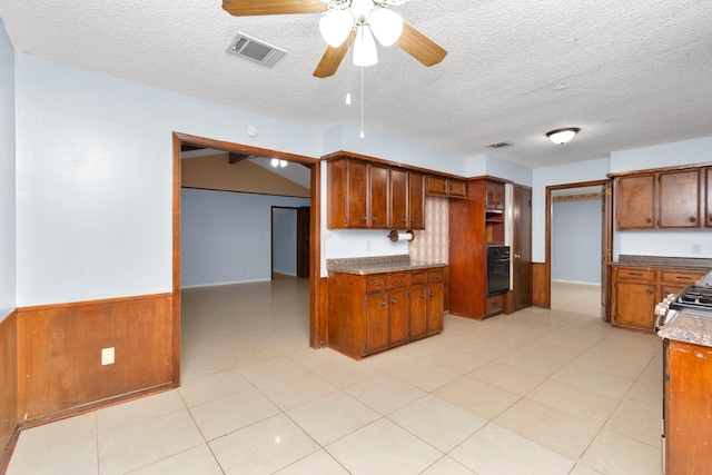 800 Fairway Dr, Richmond, TX 77469 - kitchen with a textured ceiling, oven, ceiling fan, and visible vents