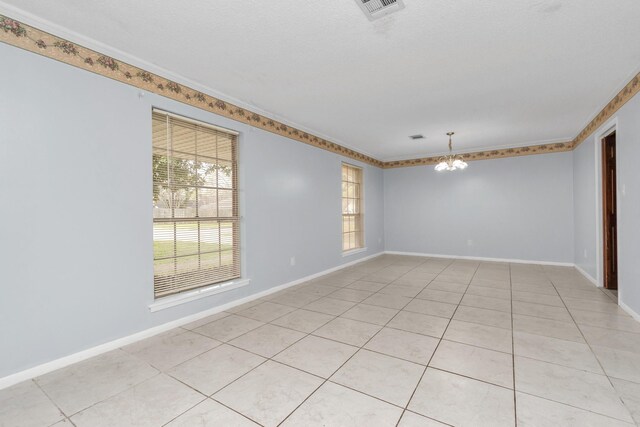 800 Fairway Dr, Richmond, TX 77469 - unfurnished room featuring visible vents, baseboards, a notable chandelier, and light tile patterned floors