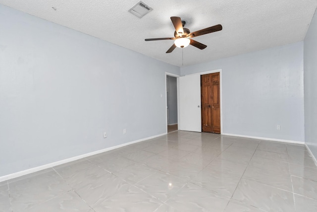 800 Fairway Dr, Richmond, TX 77469 - unfurnished room featuring visible vents, baseboards, a ceiling fan, and a textured ceiling