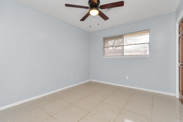 800 Fairway Dr, Richmond, TX 77469 - spare room with light tile patterned flooring, baseboards, a textured ceiling, and ceiling fan