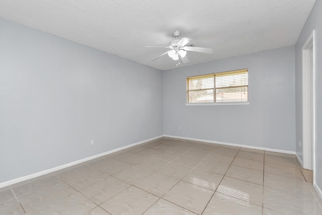 800 Fairway Dr, Richmond, TX 77469 - unfurnished room with a textured ceiling, light tile patterned floors, baseboards, and a ceiling fan