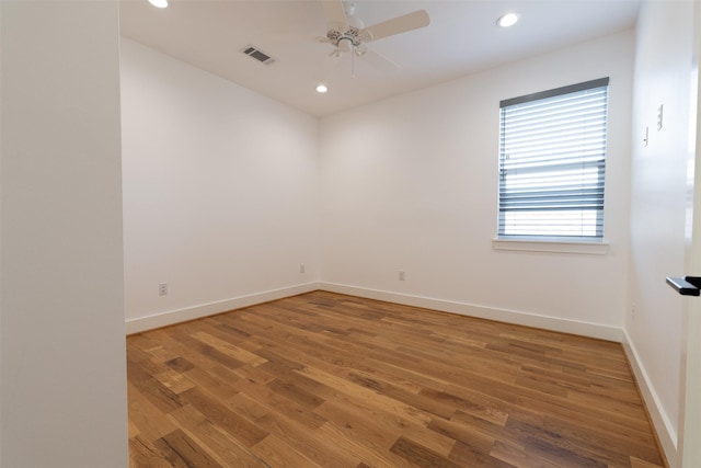 spare room with recessed lighting, baseboards, visible vents, ceiling fan, and wood finished floors