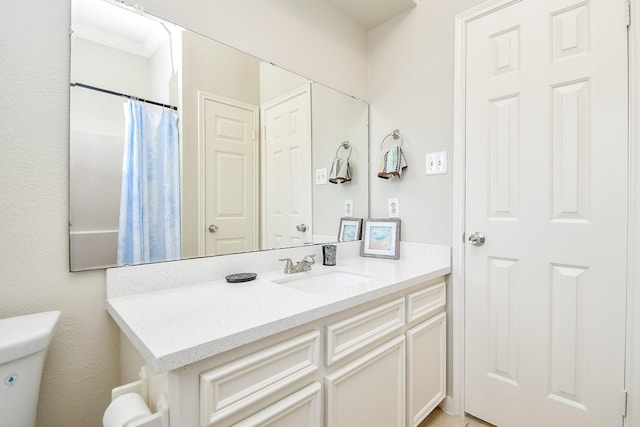 full bath featuring toilet and vanity