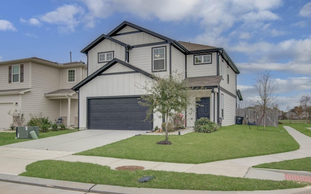 view of front of house featuring a front yard, board and batten siding, and driveway