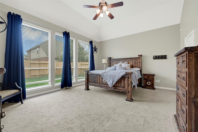 carpeted bedroom featuring lofted ceiling, a ceiling fan, baseboards, and multiple windows