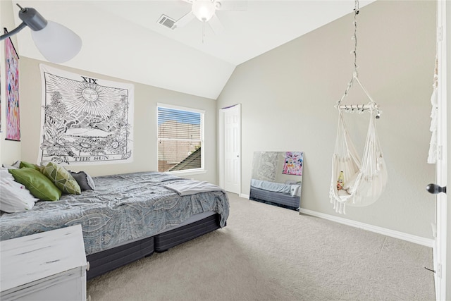 carpeted bedroom with visible vents, a closet, vaulted ceiling, and baseboards