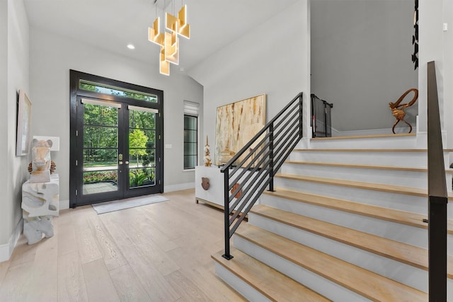513 Pineal Dr, Montgomery, TX 77316 - entryway with stairs, wood finished floors, baseboards, recessed lighting, and french doors