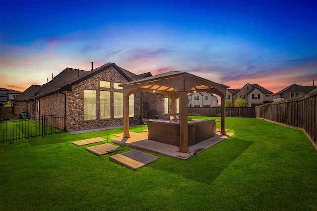 view of yard featuring an outdoor living space, a patio area, a fenced backyard, and a gazebo