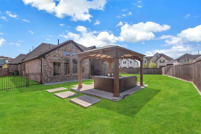 view of yard with a fenced backyard, a gazebo, a patio area, and an outdoor hangout area