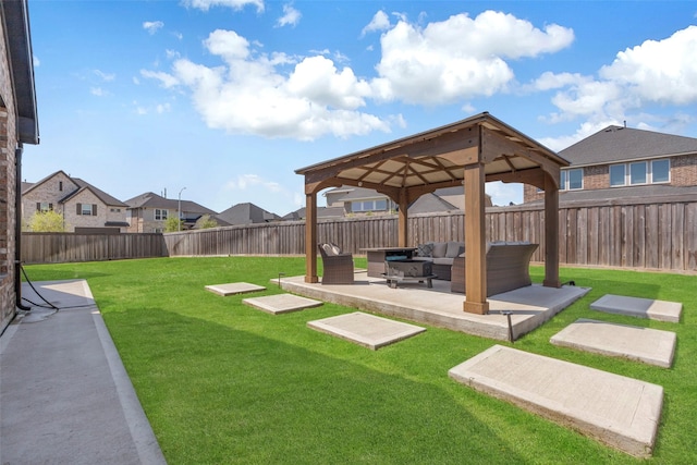 view of yard with a gazebo, outdoor lounge area, a patio area, and a fenced backyard