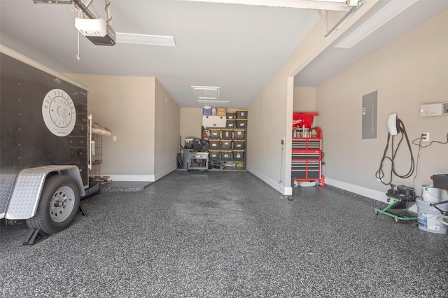 garage with electric panel and baseboards