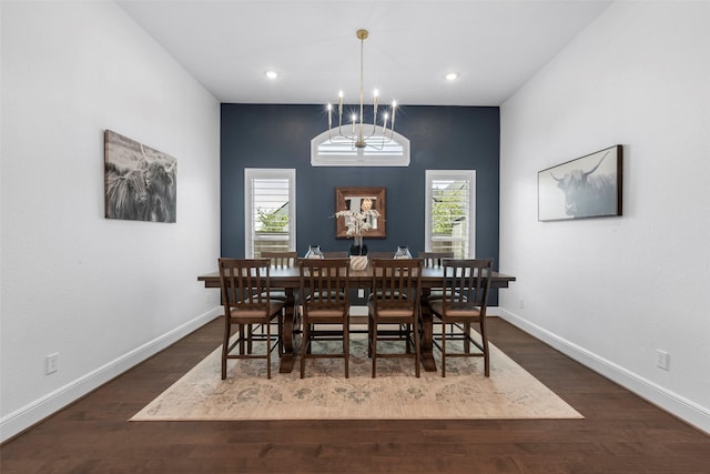 dining area with plenty of natural light, baseboards, a chandelier, and dark wood-style flooring