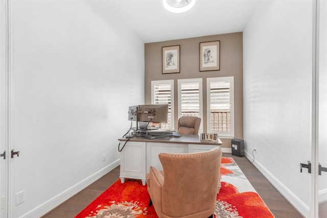 office featuring baseboards and wood finished floors