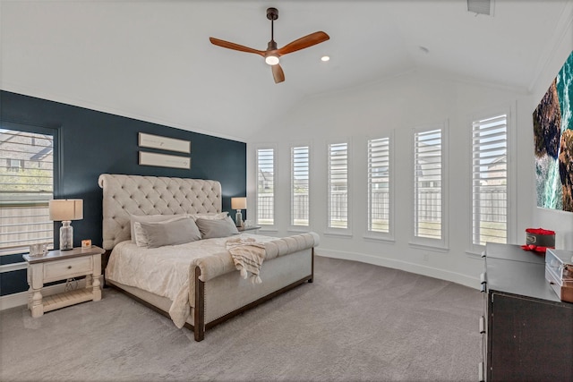 bedroom featuring lofted ceiling, baseboards, carpet, and multiple windows