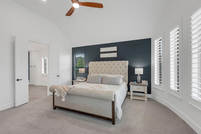 bedroom with ceiling fan, lofted ceiling, carpet floors, and baseboards