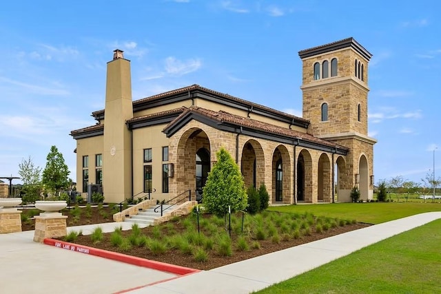 exterior space featuring stone siding, a porch, a chimney, and a front lawn