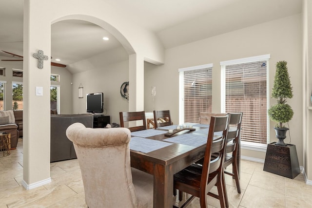 19122 Panther Cave Ct, Cypress, TX 77433 - dining space with baseboards, recessed lighting, arched walkways, and vaulted ceiling