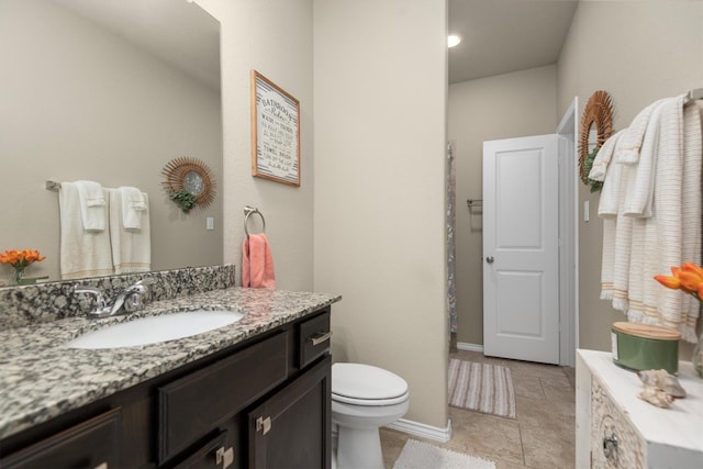 19122 Panther Cave Ct, Cypress, TX 77433 - bathroom featuring toilet, vanity, and baseboards