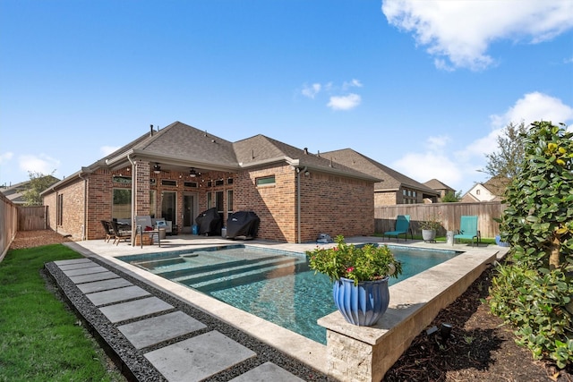 19122 Panther Cave Ct, Cypress, TX 77433 - view of swimming pool featuring a grill, a ceiling fan, a fenced backyard, a patio, and a fenced in pool