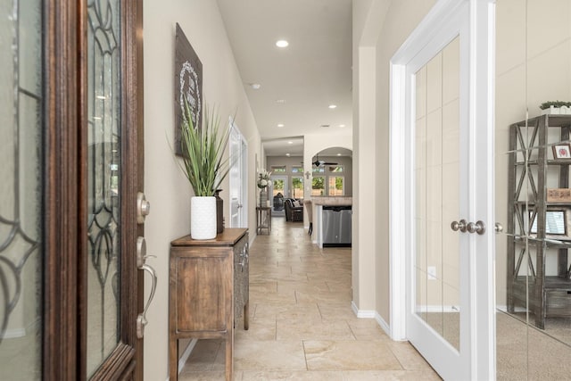 19122 Panther Cave Ct, Cypress, TX 77433 - foyer with arched walkways, recessed lighting, french doors, baseboards, and stone tile flooring