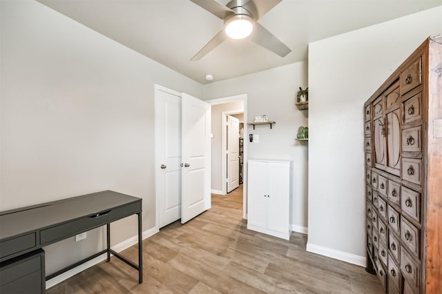 16499 Valerie Marie Pl, Conroe, TX 77306 - interior space with light wood-type flooring, a ceiling fan, and baseboards