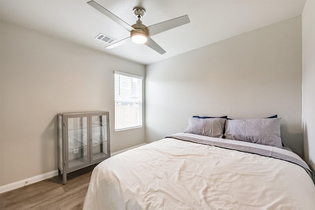 16499 Valerie Marie Pl, Conroe, TX 77306 - bedroom featuring wood finished floors, visible vents, baseboards, and ceiling fan