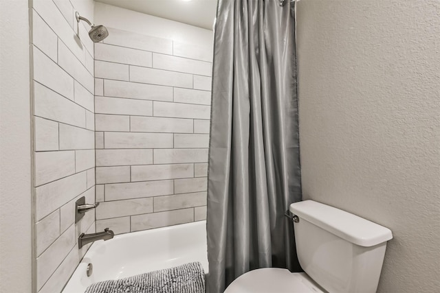 16499 Valerie Marie Pl, Conroe, TX 77306 - full bath featuring a textured wall, shower / bathtub combination with curtain, and toilet