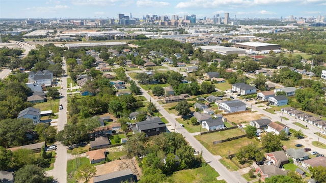birds eye view of property featuring a city view