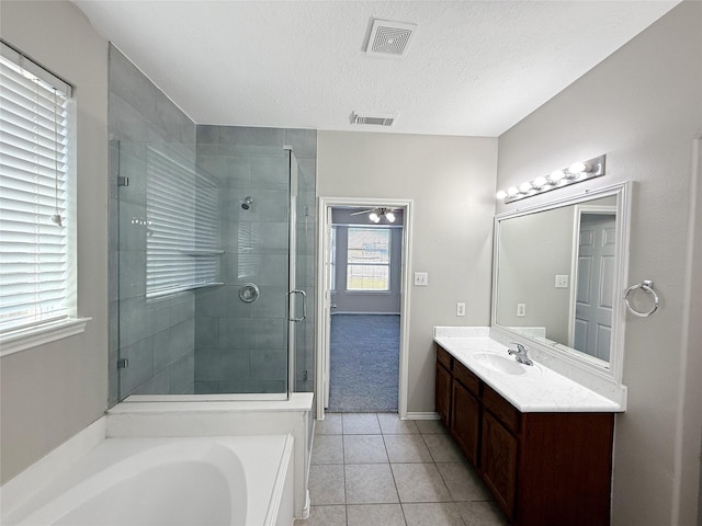 12223 Forstall Dr, Houston, TX 77014 - full bath with tile patterned flooring, vanity, visible vents, and a stall shower