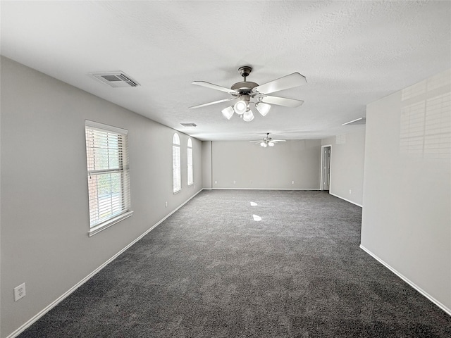 12223 Forstall Dr, Houston, TX 77014 - carpeted spare room with a textured ceiling, visible vents, baseboards, and ceiling fan