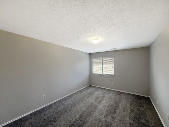 12223 Forstall Dr, Houston, TX 77014 - empty room featuring baseboards, carpet flooring, a textured ceiling, and visible vents
